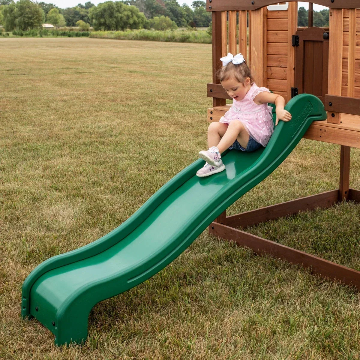 Backyard Discovery Echo Heights Cedar Wooden Elevated Kids Playhouse with Wave Slide, Play Kitchen, and Deck