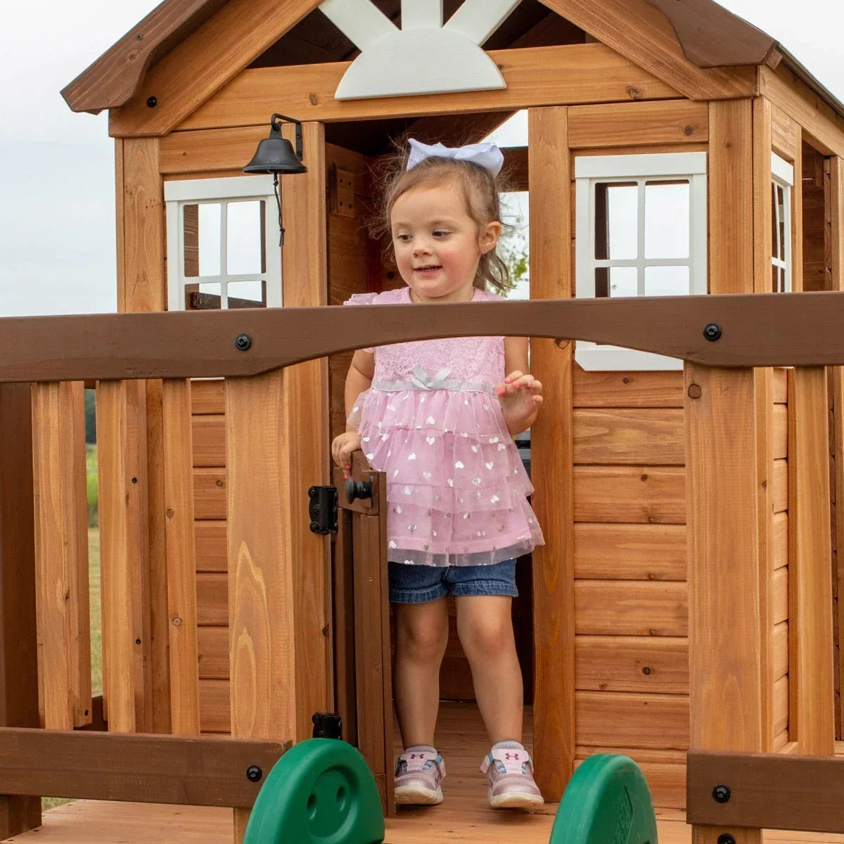 Backyard Discovery Echo Heights Cedar Wooden Elevated Kids Playhouse with Wave Slide, Play Kitchen, and Deck