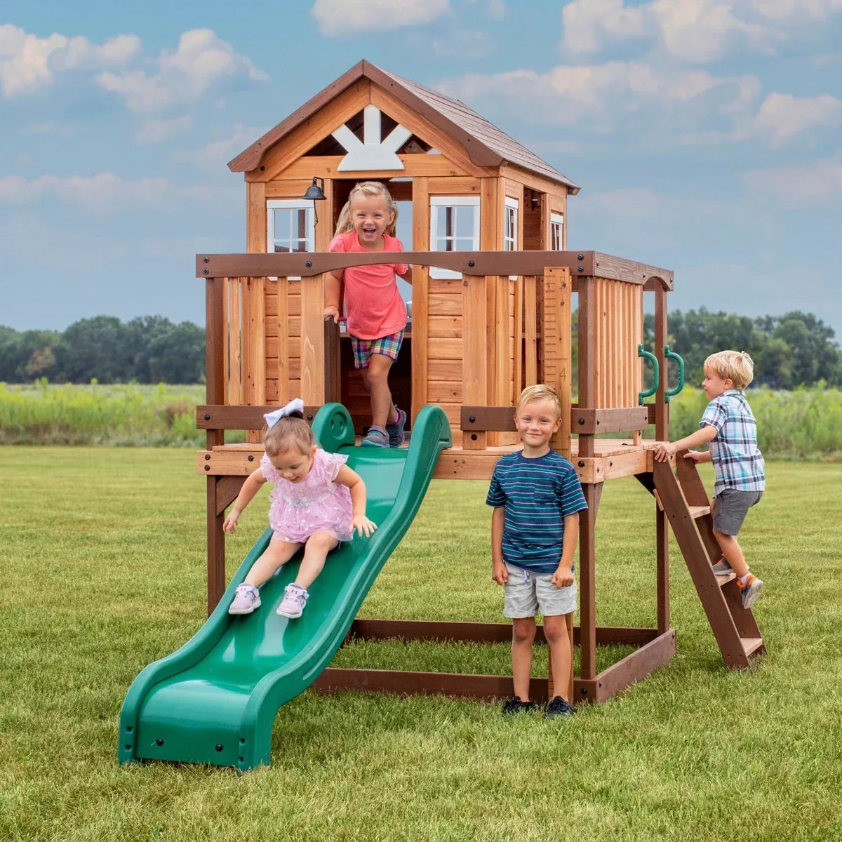 Backyard Discovery Echo Heights Cedar Wooden Elevated Kids Playhouse with Wave Slide, Play Kitchen, and Deck