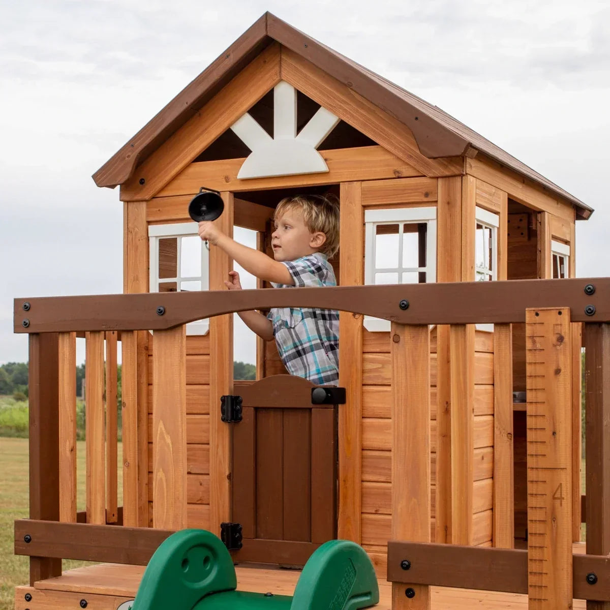 Backyard Discovery Echo Heights Cedar Wooden Elevated Kids Playhouse with Wave Slide, Play Kitchen, and Deck